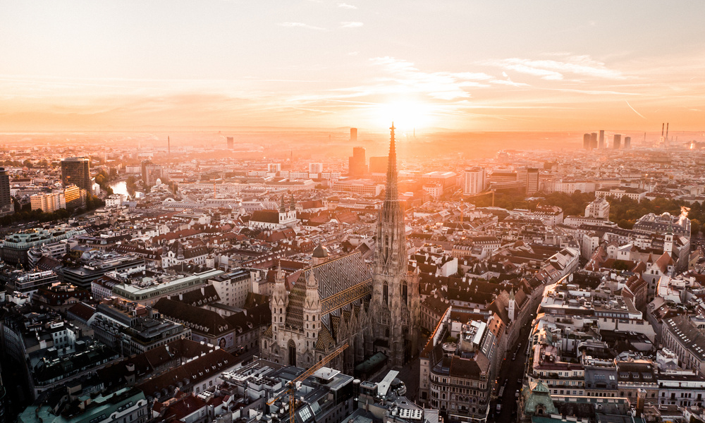 Aerial view of Vienna at sunrise with St. Stephen's Cathedral in the center of the city.