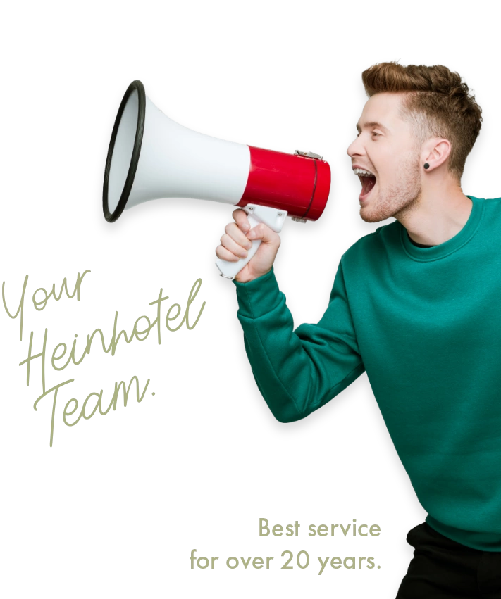 Man in a green sweater shouting into a megaphone with text: Your Heinhotel team. The best service for over 20 years.
